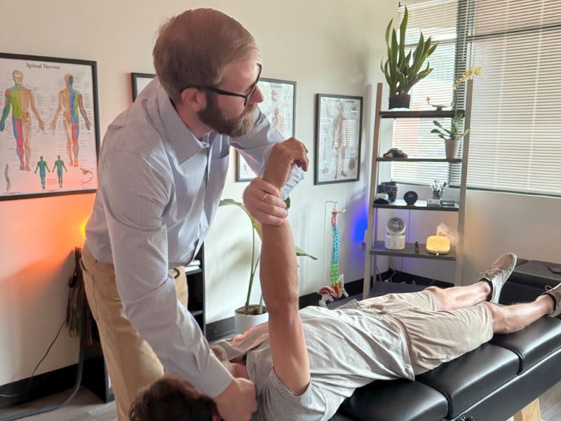 Dr. Olenek performing a chiropractic adjustment