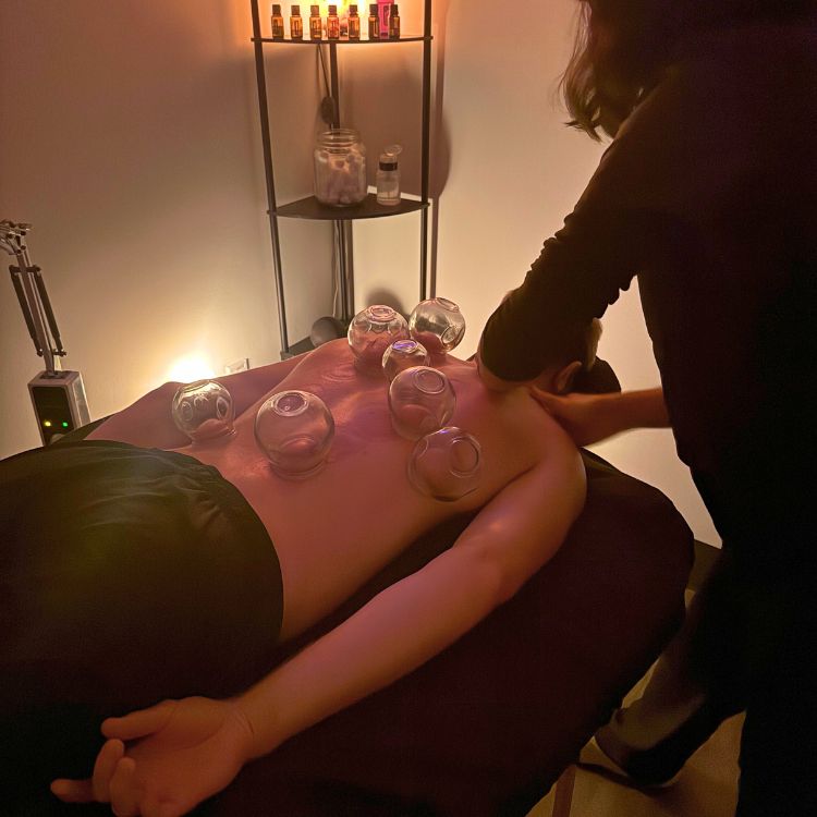 Patient getting cupping on their back